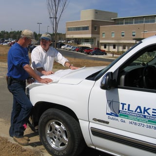 A professional landscaper share project information with the client.