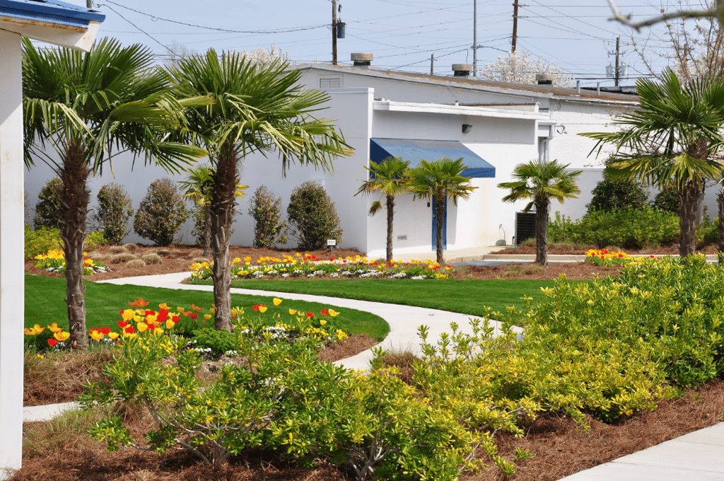 Colorful flowers, walkways, lighting and common areas add curb appeal to the ComSouth corporate campus landscape.