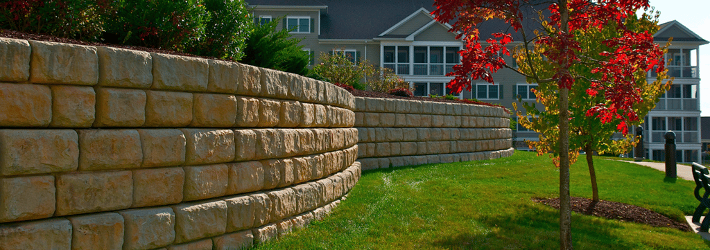 Along walkways and entryways, retaining walls are wonderful devices for creating interest features in a landscape.