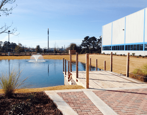 Commercial landscape construction in Dublin and Macon GA can include ponds, decking and paving